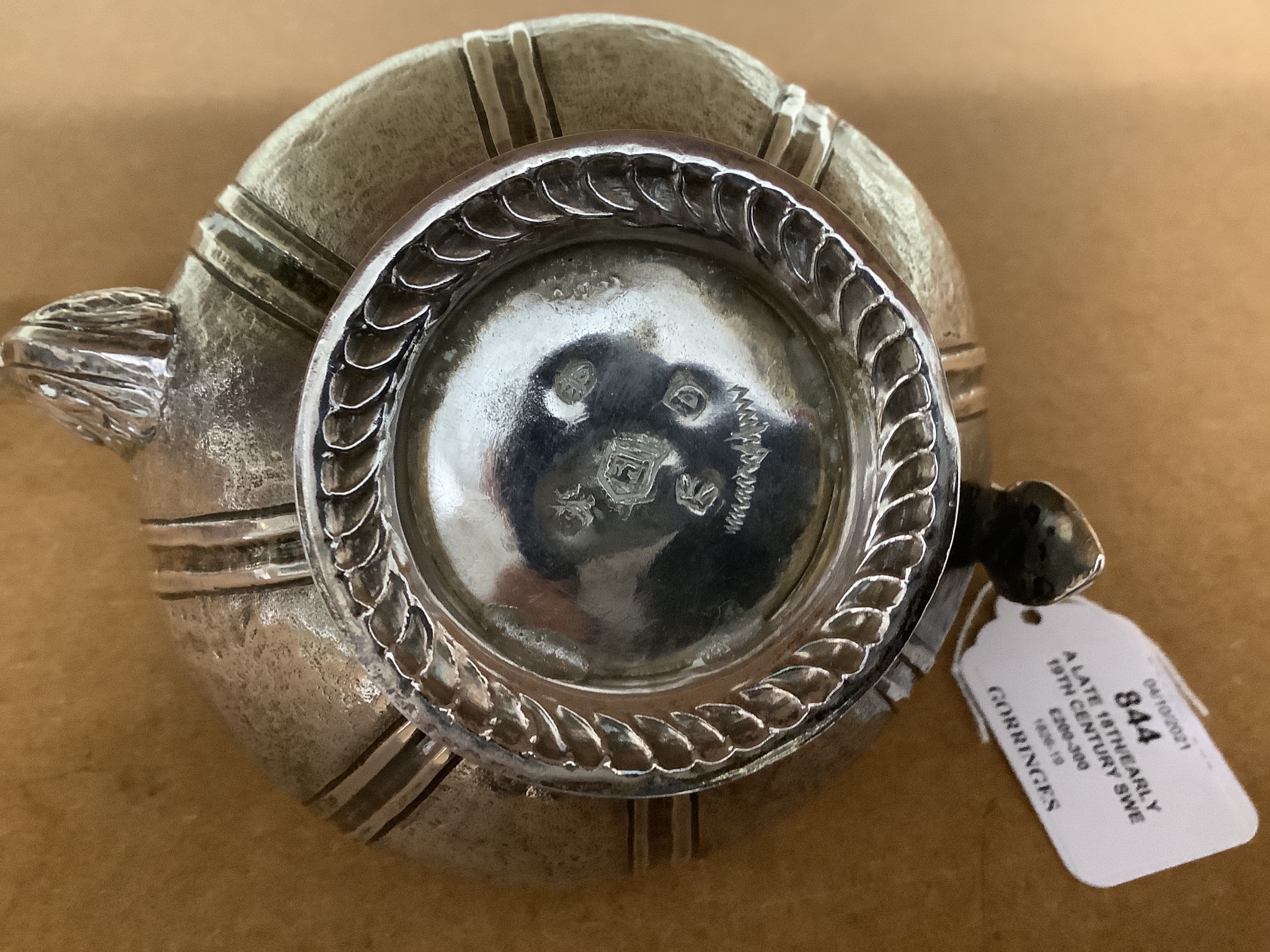 A late 18th/early 19th century Dutch? embossed white metal teapot, 13.5cm, gross 11.5oz